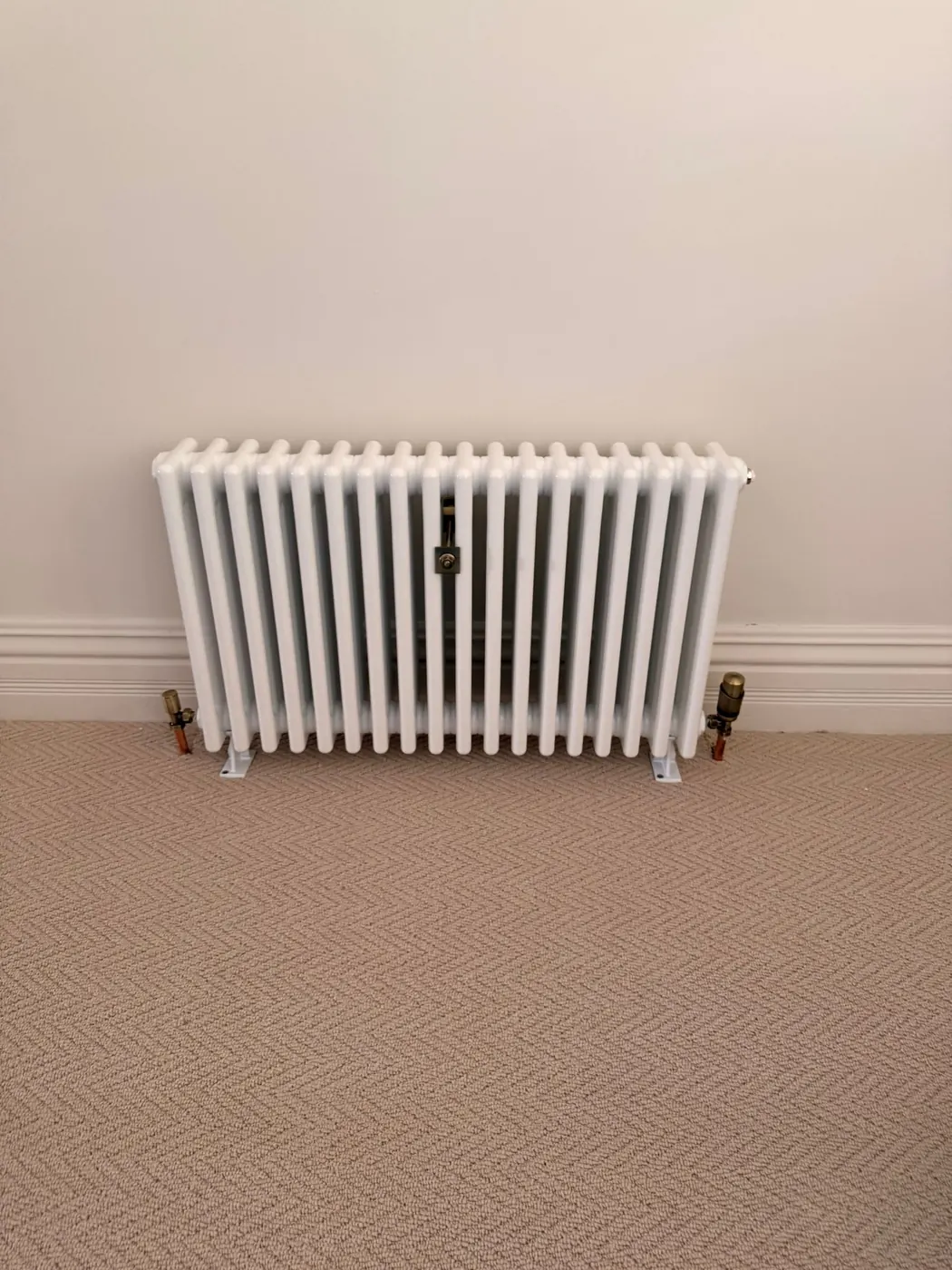 White column radiator installation